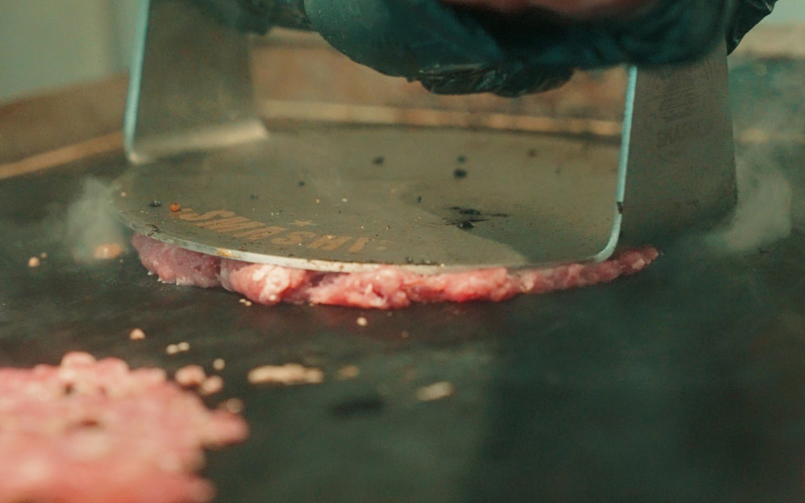 Smash burger live cooking on the plancha